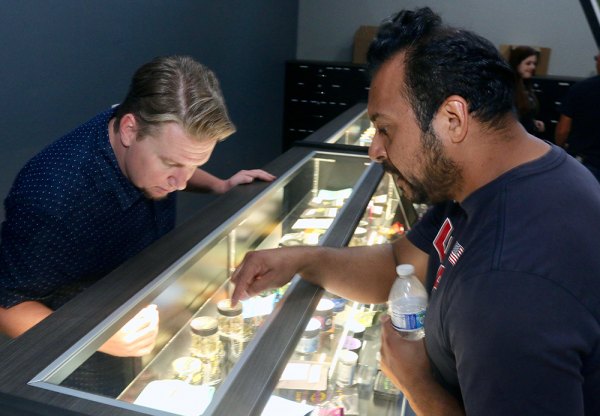 One of its first customers, Jimmy Walker, gets help from TJ Hamon Saturday morning at Valley Pure, Lemoore's first cannabis dispensary to open in Lemoore.
